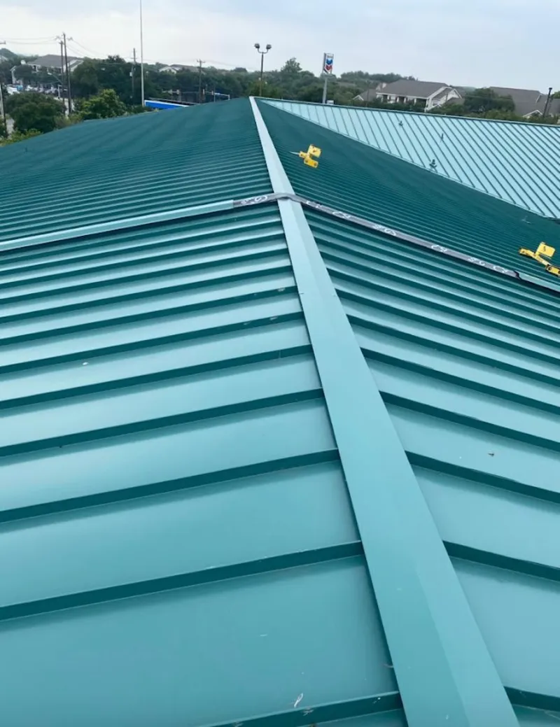 Green commercial metal roof ridge and valley for Metal Roof Repair in Grand Blanc